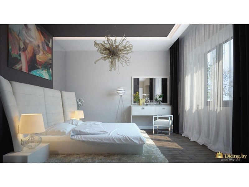 спальная зона: низкая кровать, белый туалетный столик, картина с абстрактным изображением