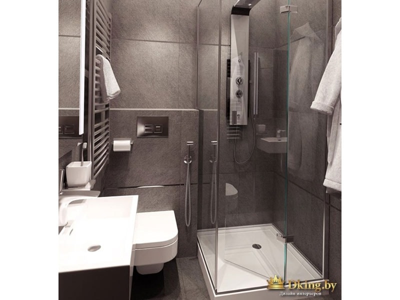 серая плитка большого формата в ванной. декор - стальной фриз. лаконичный душевой уголок с прозрачными стекляными дверями. подвесной унитаз, полотенцесушитель лесенка