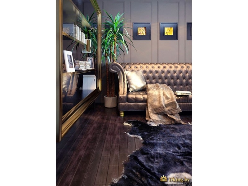 шикарный диван с обивкой бронзового цвета, на полу - ковер в виде шкуры. темные стены и пол в стиле ар-деко