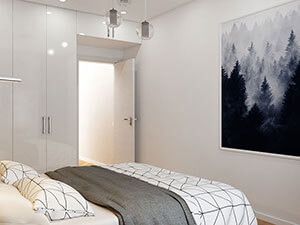 белый встроенный распашной шкаф в интерьере маленькой спальни